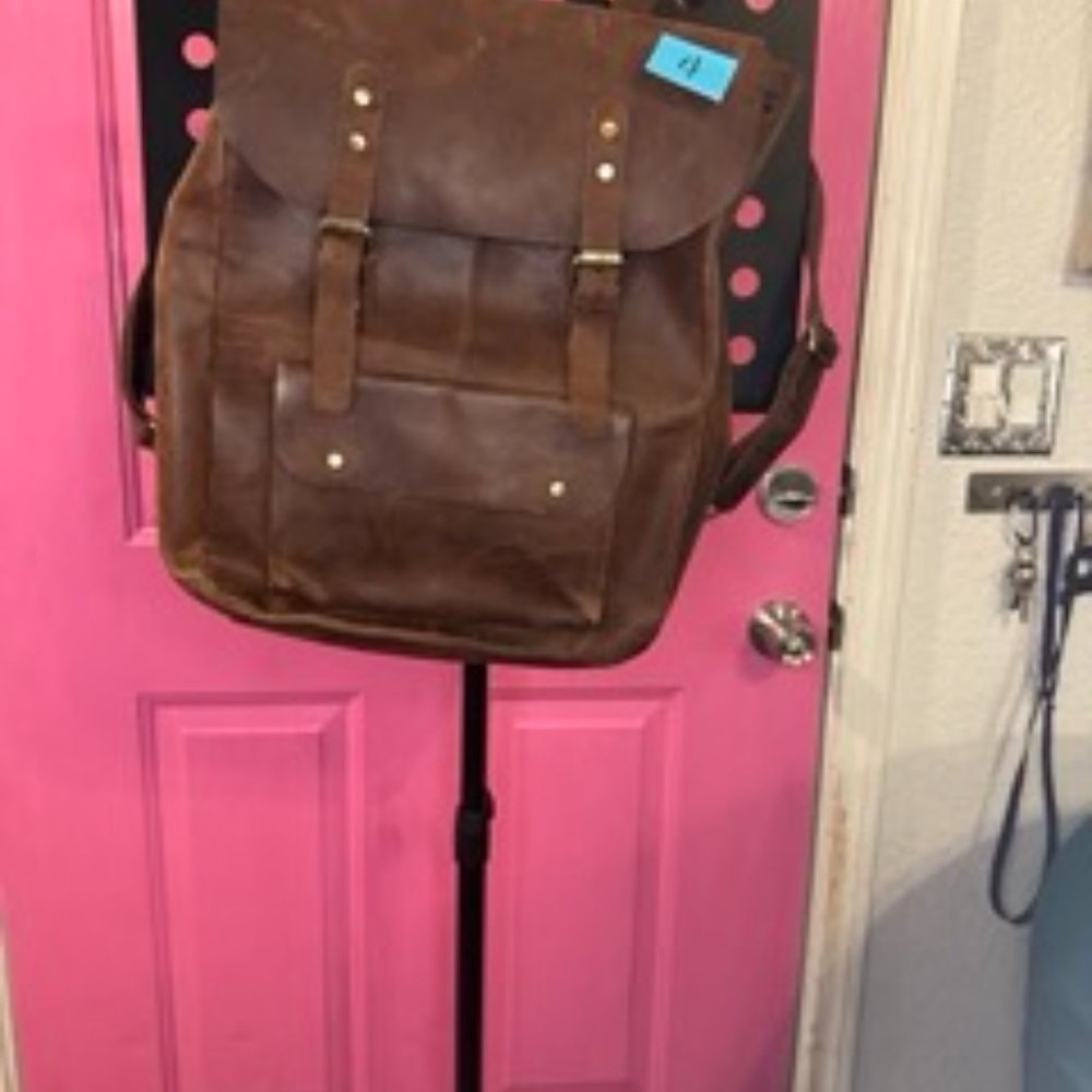 Backpack- Brown real leather. Damage on the strap. Perfect for a laptop.